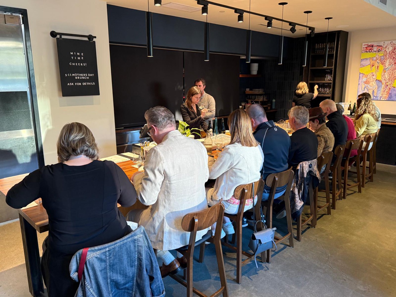 Guests seated around a table at the Maison V Sake Dinner in Seattle